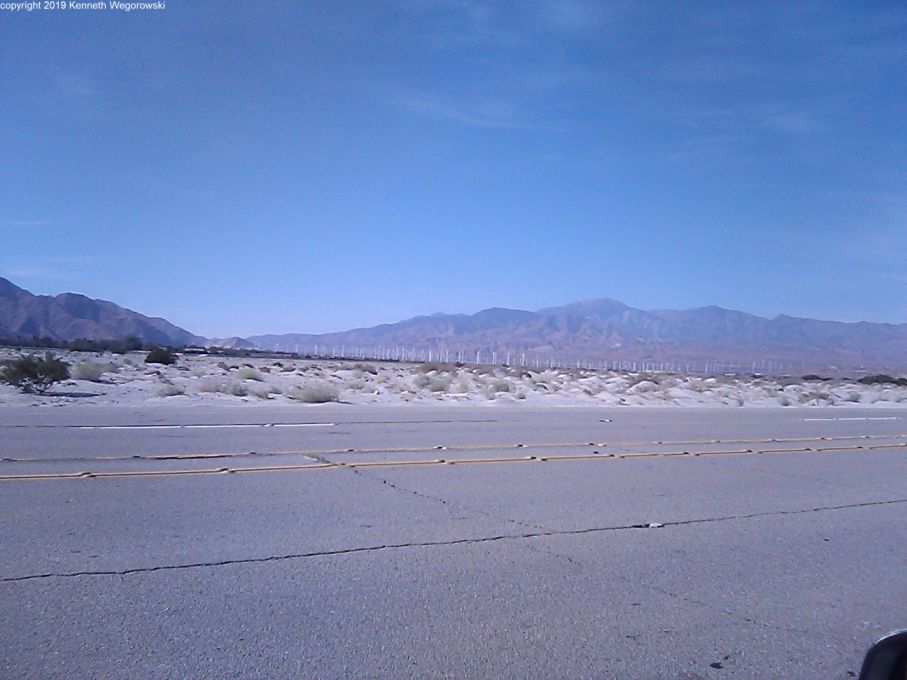 looking west on Gene Autry Trail in Palm Springs the farms start about 3 miles away extending to the right about 6 miles or more